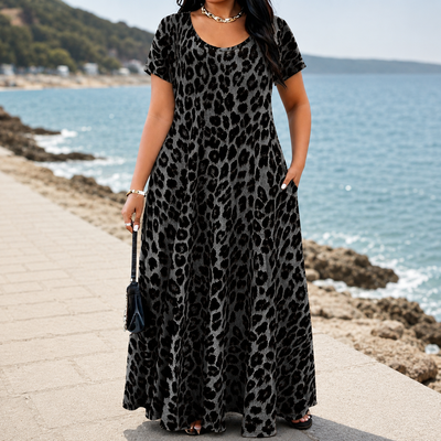 Women's short-sleeved, long leopard-print dress with pockets.